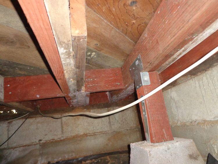 Re-supporting a portion of damaged subfloor